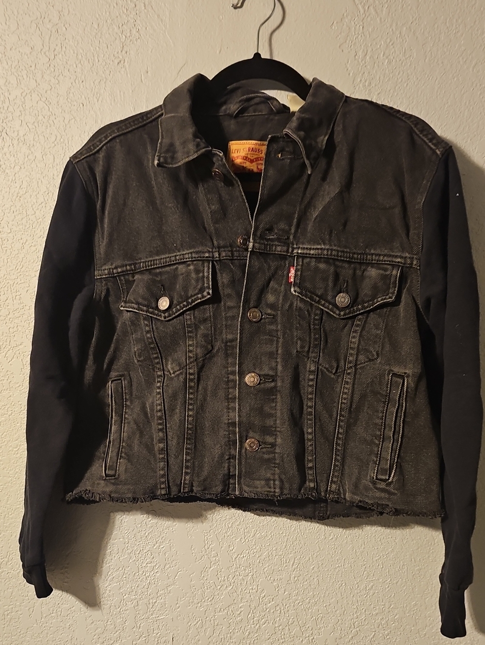 Levi's Black Denim Jacket with Dark Knit Sleeves and Raw Hem